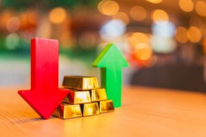 金の延べ棒と赤・緑の矢印